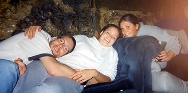 Sean, Lisa, and Dom lounging in the Cave, the bums